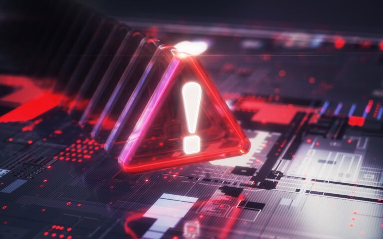 Alert icon on digital circuit board indicating inventory risks or system issues related to MRO management.