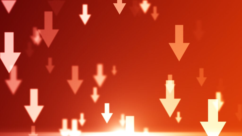Downward trending arrows representing supply chain reduction and cost optimization in manufacturing.