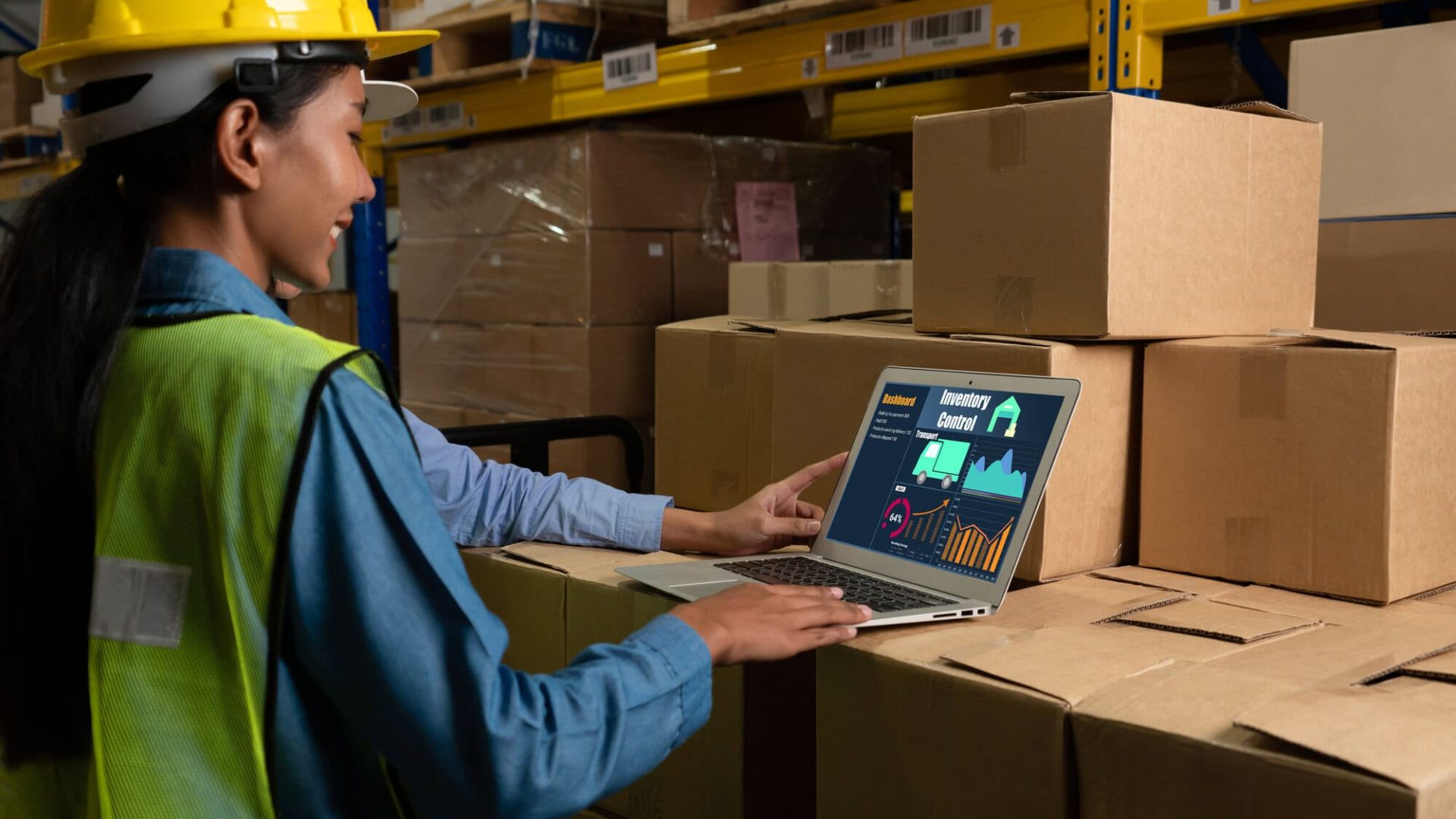 Warehouse management software application in computer for real time monitoring of goods package delivery . PC screen showing smart inventory dashboard for storage and supply chain distribution .