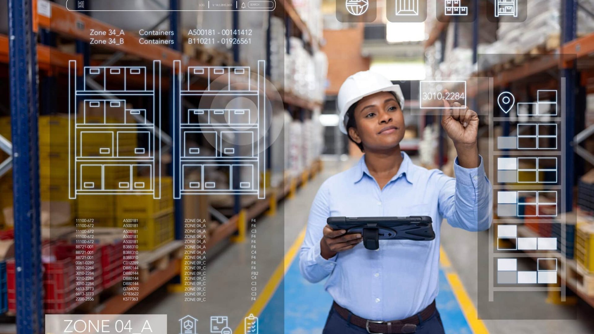 Forperson organizing the distribution of merchandise at a warehouse using an automated system displayed on a screen in front of her
