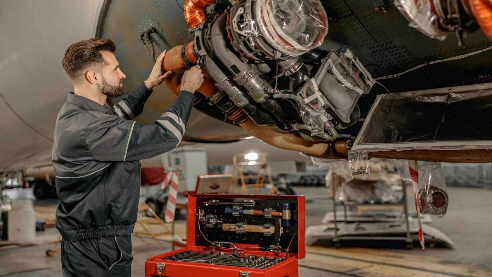 Man working on a plane engine
