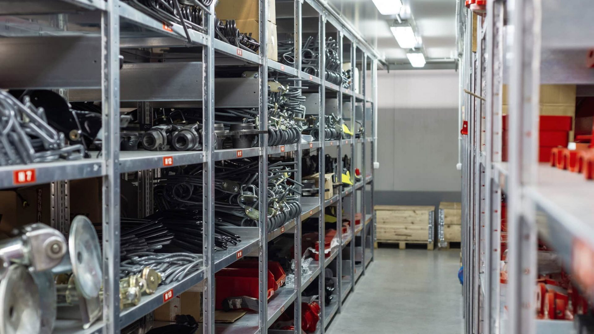 Storage shelves with industrial MRO parts and equipment in a warehouse.