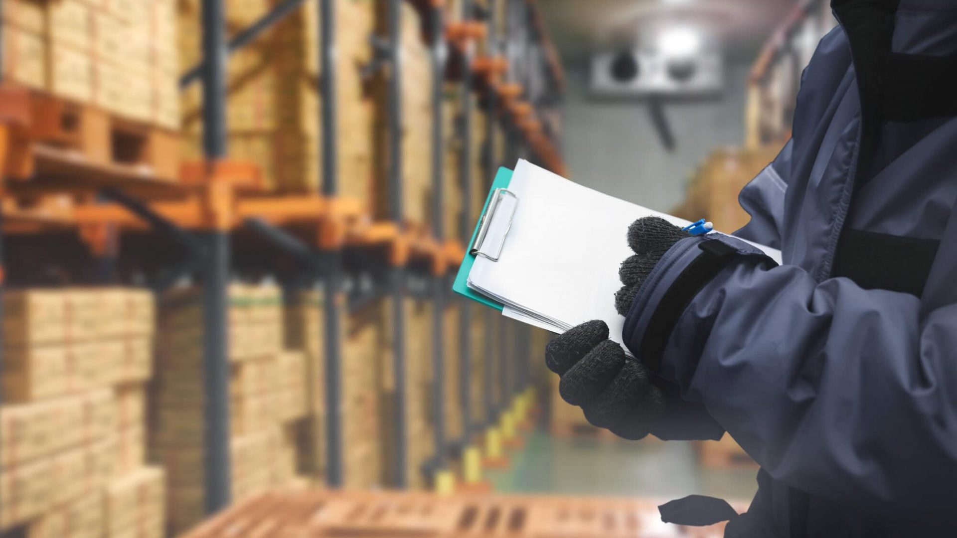 Warehouse inventory management with clipboard and barcode scanner.