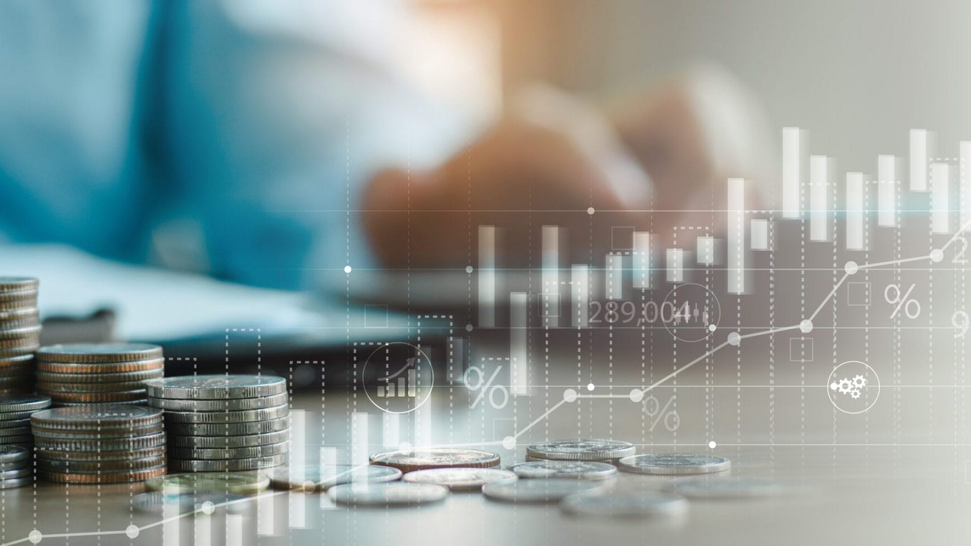 finance and investment, currency exchange concept. Accountant using calculator with coins and financial report, economic graph growth, finance background, Business, accounting banking concept.