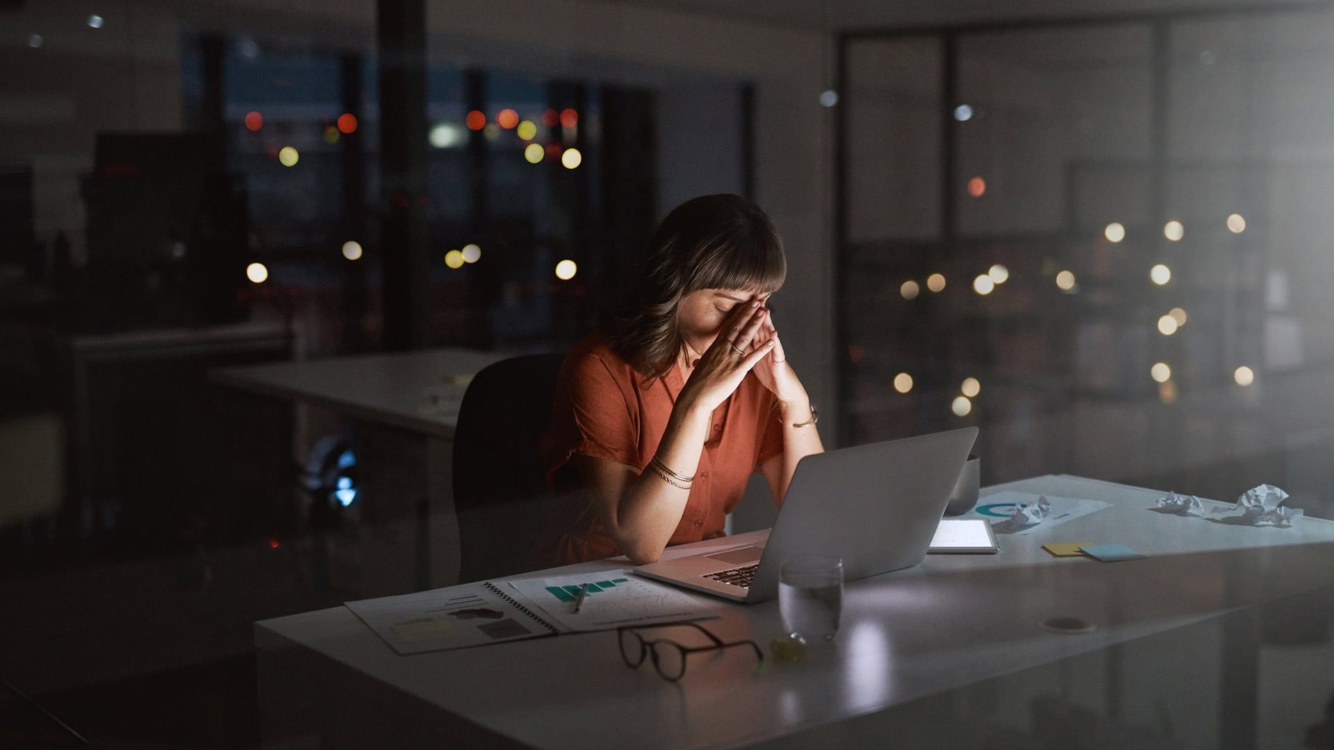 Woman holding her face tired