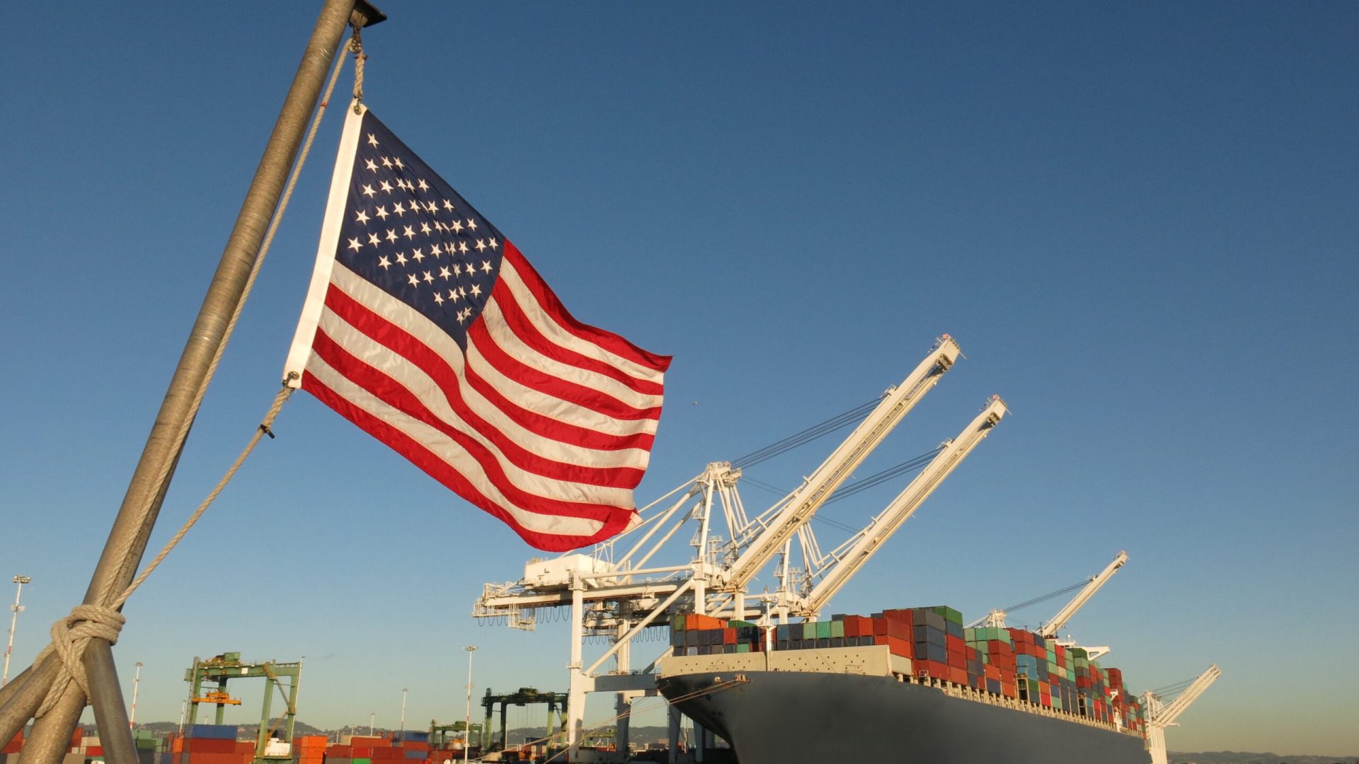 American flag US port container ship symbols economy industry pride American supply chains
