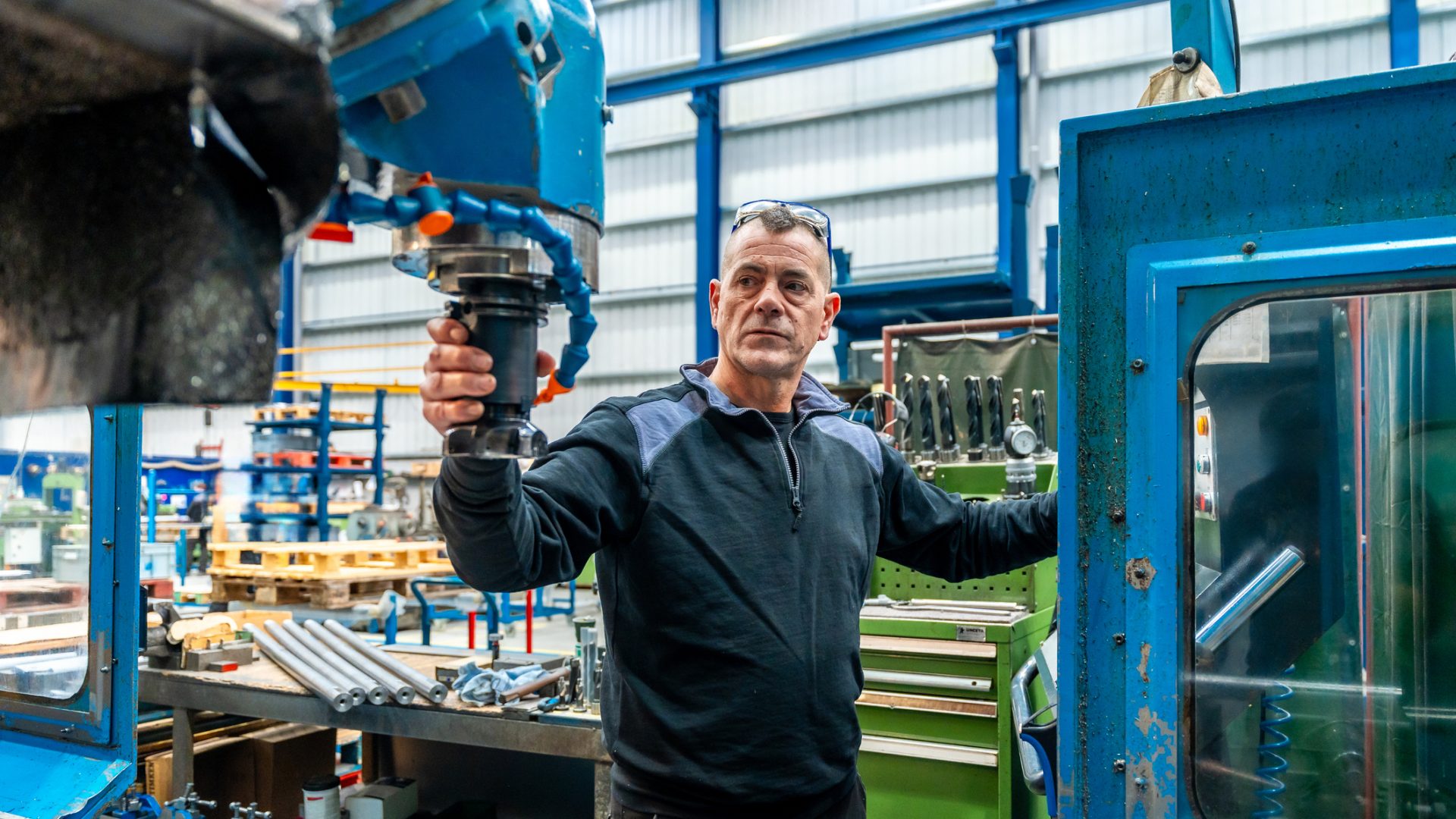 Engineer working in front of automated CNC machine MRO Data Challenges