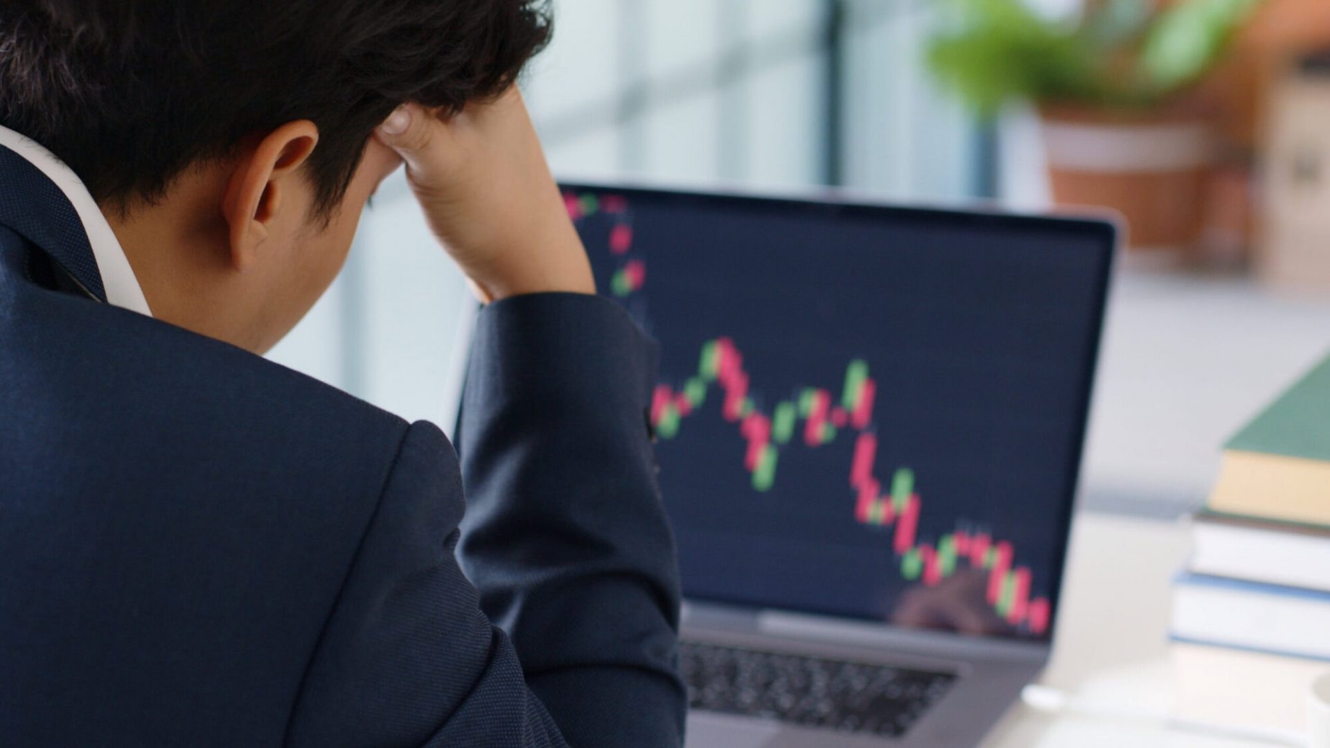 Stressed businessman feeling desperate on crisis stock market, investment concept.